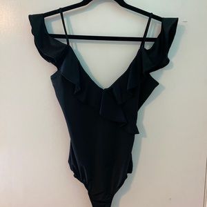 Black off the shoulder body suit with ruffles